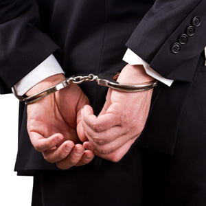 a man with his hands cuffed behind his back